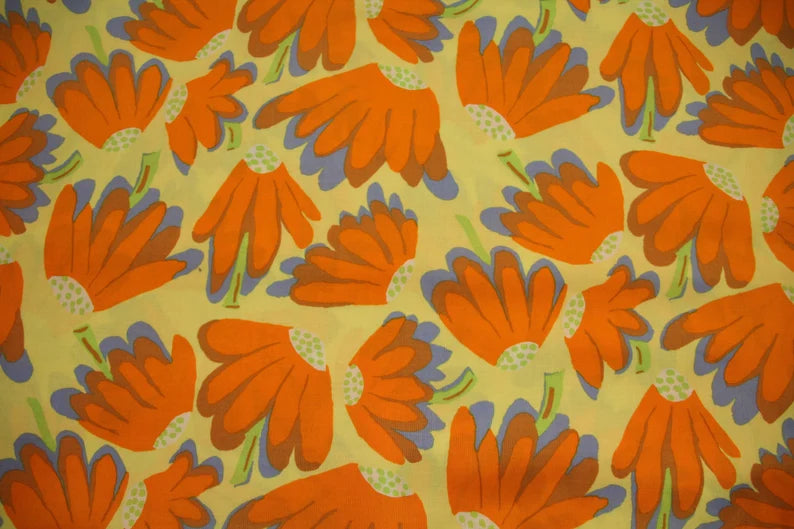 Designerstof Lazy Daisy in oranje tinten – patchwork katoen