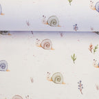 Swafing “Life in the Forest – slakken” Jersey · crème pasteltinten · ±140 cm breed - Stitch & Sew